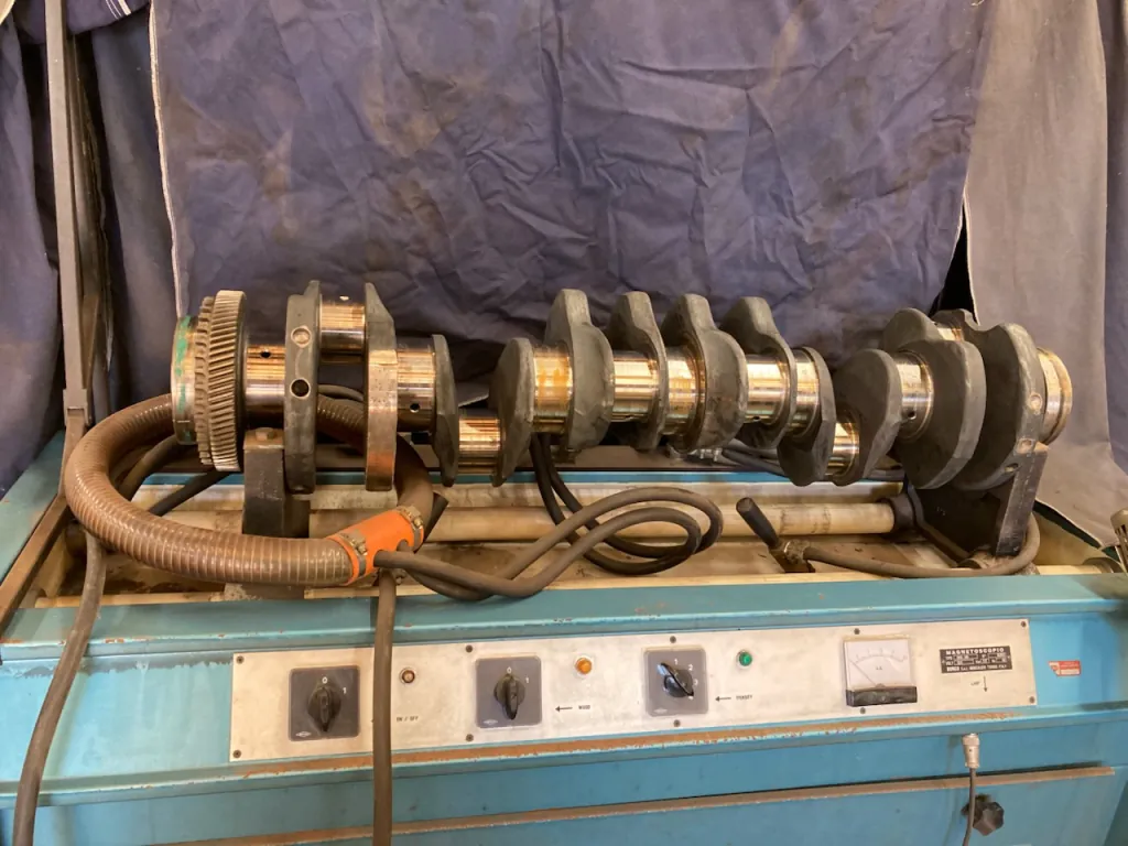 Magnaflux machine inspecting a crankshaft for cracks